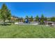 Community playground featuring a colorful play structure, picnic benches, and well-maintained green space at 10556 Sariah Skye Ave, Las Vegas, NV 89166