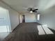 Large bedroom with plush carpet, ceiling fan, and natural light at 10715 York Manor Ave, Las Vegas, NV 89166