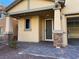 Home featuring a covered front porch with stone pillar accents at 10715 York Manor Ave, Las Vegas, NV 89166
