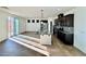Open kitchen featuring a spacious island, stainless steel appliances, and a seamless connection to outdoor space at 10715 York Manor Ave, Las Vegas, NV 89166
