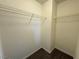 Walk-in closet with built-in shelving and carpeted floor at 10715 York Manor Ave, Las Vegas, NV 89166