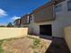 View of the exterior of the home and the backyard with a block wall at 1739 N Lamont St, Las Vegas, NV 89115