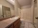 Bathroom showcasing vanity with a sink, toilet, and a tiled shower-tub combo at 1739 N Lamont St, Las Vegas, NV 89115
