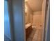 Bathroom featuring a vanity with storage, toilet, and tiled shower-tub combination at 1739 N Lamont St, Las Vegas, NV 89115