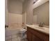 Bathroom showcasing vanity with sink, toilet, and tiled shower-tub combo at 1739 N Lamont St, Las Vegas, NV 89115