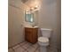 Bathroom with a wooden vanity, mirror and a toilet at 1739 N Lamont St, Las Vegas, NV 89115