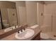 Bathroom showcasing vanity with a sink, toilet, and a tiled shower-tub combo at 1739 N Lamont St, Las Vegas, NV 89115