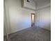 Bedroom featuring plush carpeting and natural light from window and door at 1739 N Lamont St, Las Vegas, NV 89115