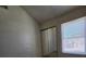 Bedroom featuring plush carpeting, closet with mirrored doors, and natural light from window at 1739 N Lamont St, Las Vegas, NV 89115