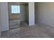 Bedroom featuring neutral carpet, large mirror closet and window allowing for natural light at 1739 N Lamont St, Las Vegas, NV 89115