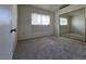 Bedroom featuring plush carpeting, closet with mirrored doors, and natural light from window at 1739 N Lamont St, Las Vegas, NV 89115