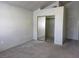 Bedroom with neutral carpet, closet with mirrored doors, and natural light at 1739 N Lamont St, Las Vegas, NV 89115