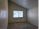 Bedroom featuring neutral carpet and window allowing for natural light at 1739 N Lamont St, Las Vegas, NV 89115
