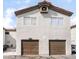 Charming two-story townhome featuring private garages and desert landscaping at 1739 N Lamont St, Las Vegas, NV 89115