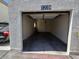 Open garage with ceiling fan and door to inside the home at 1739 N Lamont St, Las Vegas, NV 89115