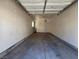 Empty garage with ceiling fan and door to inside the home at 1739 N Lamont St, Las Vegas, NV 89115