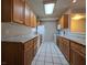 Traditional kitchen with tile floor, ample counter space, and a full suite of appliances at 1739 N Lamont St, Las Vegas, NV 89115