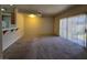 Open-concept living room with sliding doors to the outside and carpeted flooring at 1739 N Lamont St, Las Vegas, NV 89115