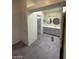 Bathroom with a double sink vanity and a doorway that leads to a toilet and tub at 1745 Starridge Way, Las Vegas, NV 89142