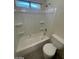 Bathroom with a white toilet and tub with shower at 1745 Starridge Way, Las Vegas, NV 89142