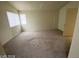 This bedroom offers natural light, neutral colors, and comfortable carpet at 1745 Starridge Way, Las Vegas, NV 89142