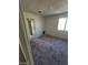 A standard bedroom features a window for natural light and includes access to another room at 1745 Starridge Way, Las Vegas, NV 89142