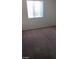 Comfortable bedroom with neutral walls, a large window, and plush carpeting at 1745 Starridge Way, Las Vegas, NV 89142
