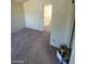 View of bedroom leading to hallway with a staircase at 1745 Starridge Way, Las Vegas, NV 89142