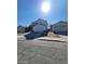 Two-story home featuring an attached two-car garage and separate garage on a sunny day at 1745 Starridge Way, Las Vegas, NV 89142