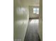Hallway view into a bedroom with a window providing natural light and an interior view of the space at 1745 Starridge Way, Las Vegas, NV 89142