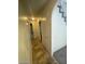 Well-lit hallway with tile flooring and access to storage and a bathroom, offering practical and accessible living space at 1745 Starridge Way, Las Vegas, NV 89142