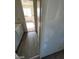Hallway view into a bedroom with a window for natural light and an interior view of the space at 1745 Starridge Way, Las Vegas, NV 89142