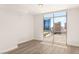 Bedroom with hardwood floors and expansive views of the city skyline through a large window at 200 W Sahara Ave # 2204, Las Vegas, NV 89102