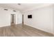 Open bedroom layout with hardwood floors, recessed lighting, and ensuite door at 200 W Sahara Ave # 2204, Las Vegas, NV 89102