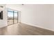 Bright bedroom with hardwood floors, recessed lighting, and large window with city views at 200 W Sahara Ave # 2204, Las Vegas, NV 89102