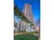 Striking full view of a high-rise building with the Allure sign and decorated palm trees at 200 W Sahara Ave # 2204, Las Vegas, NV 89102