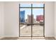 Expansive city view showcasing hotels and casinos through a large picture window at 200 W Sahara Ave # 2204, Las Vegas, NV 89102