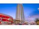 Exterior shot of a modern high-rise building with a view of a nearby entertainment complex and busy city street at 200 W Sahara Ave # 2204, Las Vegas, NV 89102