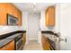 Contemporary kitchen featuring stainless steel appliances and wood cabinets at 200 W Sahara Ave # 2204, Las Vegas, NV 89102