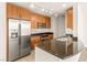 Modern kitchen with stainless steel appliances, wood cabinets and granite countertops at 200 W Sahara Ave # 2204, Las Vegas, NV 89102