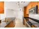 Well-equipped kitchen featuring a stainless steel refrigerator and granite countertops at 200 W Sahara Ave # 2204, Las Vegas, NV 89102