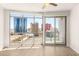 Bright living room with large windows providing stunning views of the city skyline at 200 W Sahara Ave # 2204, Las Vegas, NV 89102