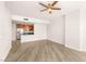 Spacious living area showcasing hardwood floors and a modern kitchen with stainless steel appliances at 200 W Sahara Ave # 2204, Las Vegas, NV 89102