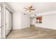 Open-concept living area with hardwood floors, modern ceiling fan, and a view of the kitchen at 200 W Sahara Ave # 2204, Las Vegas, NV 89102