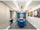 Modern lobby area with stylish blue table, artistic wall decor, and ambient lighting at 200 W Sahara Ave # 2204, Las Vegas, NV 89102