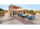 Stylish outdoor lounge with ample seating, bar area, and fire feature, ideal for entertaining and relaxation at 200 W Sahara Ave # 2204, Las Vegas, NV 89102
