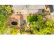 Overhead view of backyard featuring a water feature, gazebo, covered patio and mature trees at 226 Dalmatian Ln, Las Vegas, NV 89107