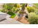 Aerial view of a backyard oasis showcasing mature landscaping, a gazebo, and a koi pond at 226 Dalmatian Ln, Las Vegas, NV 89107