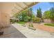 Private backyard with lush landscaping, a covered patio, a gazebo, and an outdoor living space at 226 Dalmatian Ln, Las Vegas, NV 89107