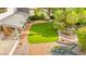 Stunning backyard featuring lush landscaping, a water feature, and a cozy covered patio at 226 Dalmatian Ln, Las Vegas, NV 89107